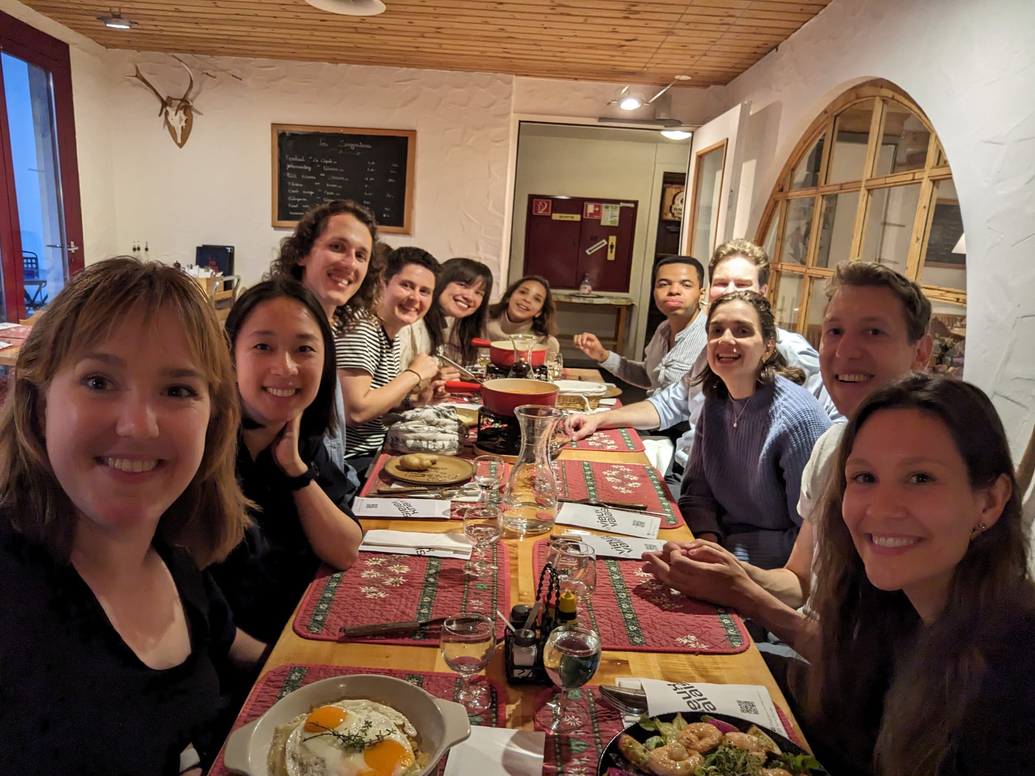 Geneva Hub members sharing a meal in 2025